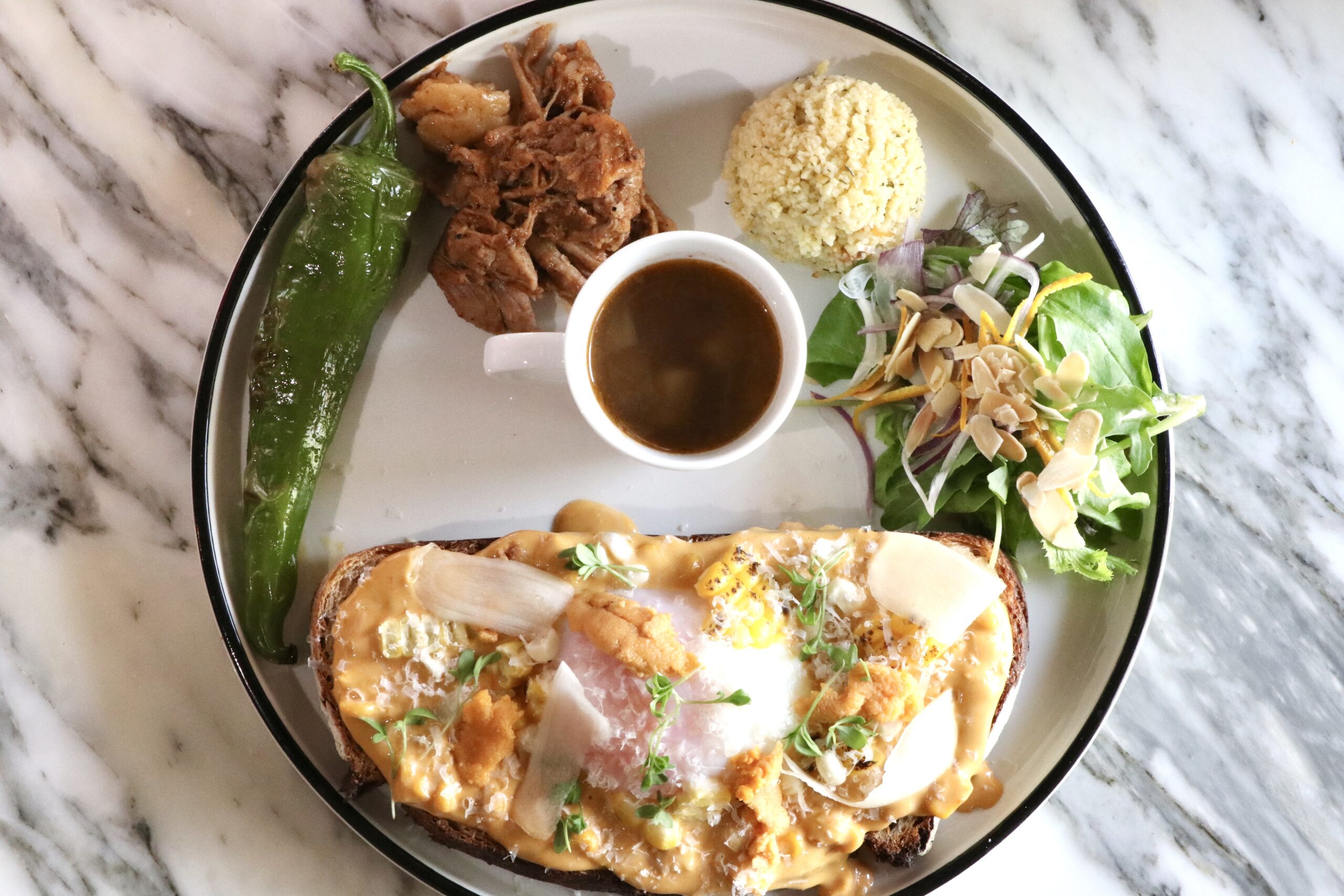 Sea urchin and Poached egg Tartine meal